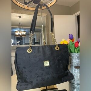 MCM Black Tote Bag with Zippered Top and Gold Chains and Accents